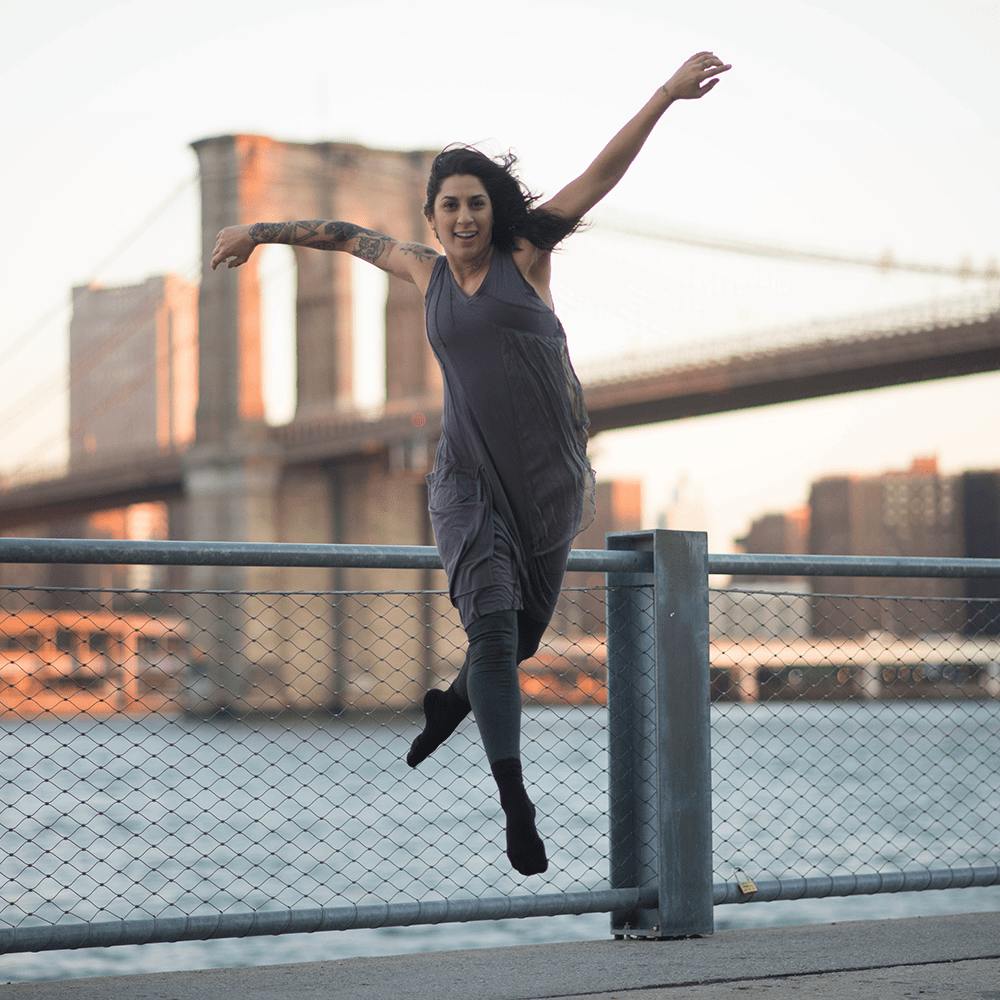 Woman dancing in New York with padded dance socks with ankle support on