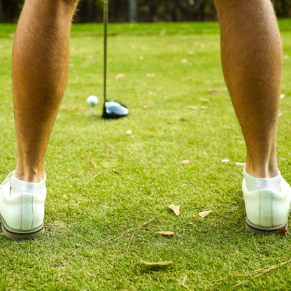 AMP white athletic socks worn as golf socks