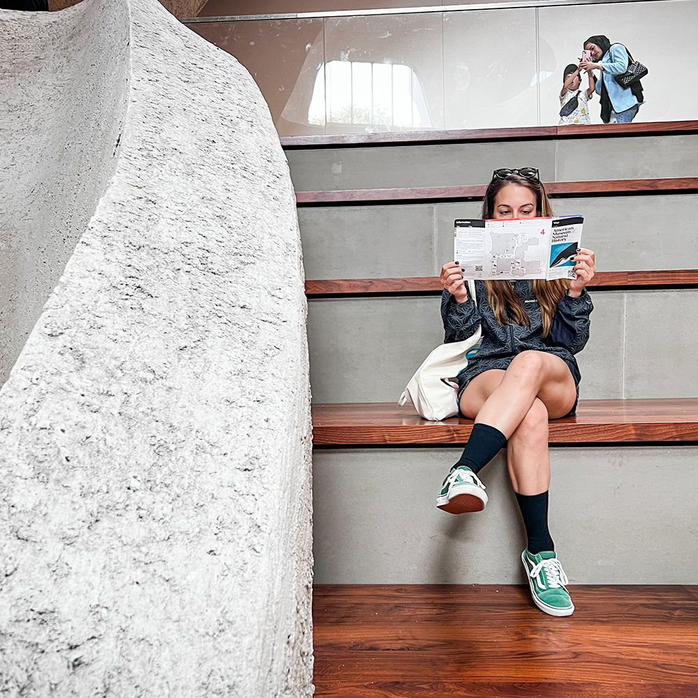 Woman wearing compression socks for pregnancy while reading