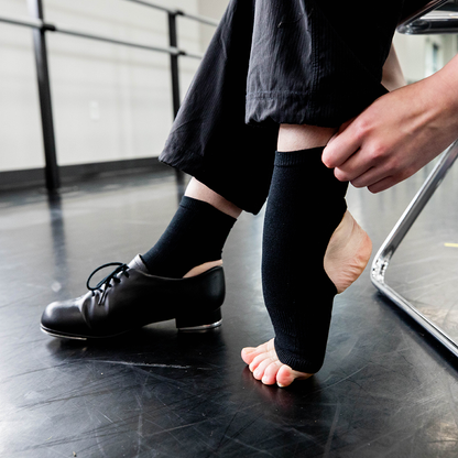 Black Joule dance socks with ankle support worn inside tap shoes at dance studio