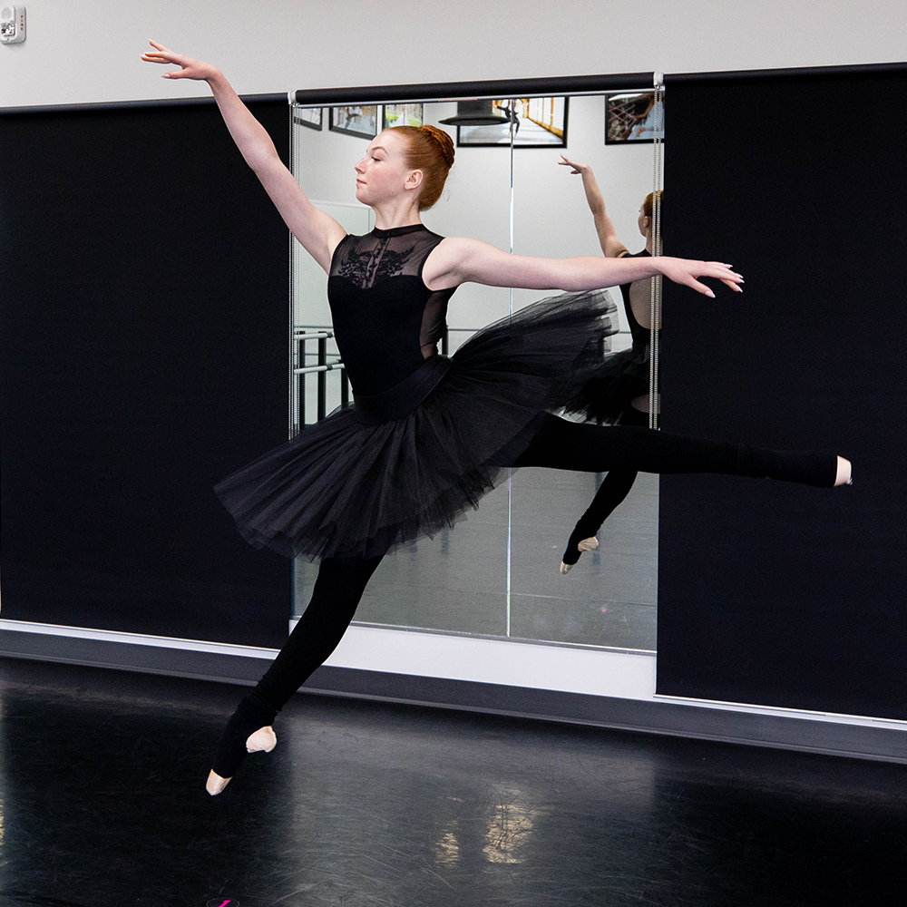 Ballerina shoes with arch support and ankle support worn by ballerina dancing in her studio