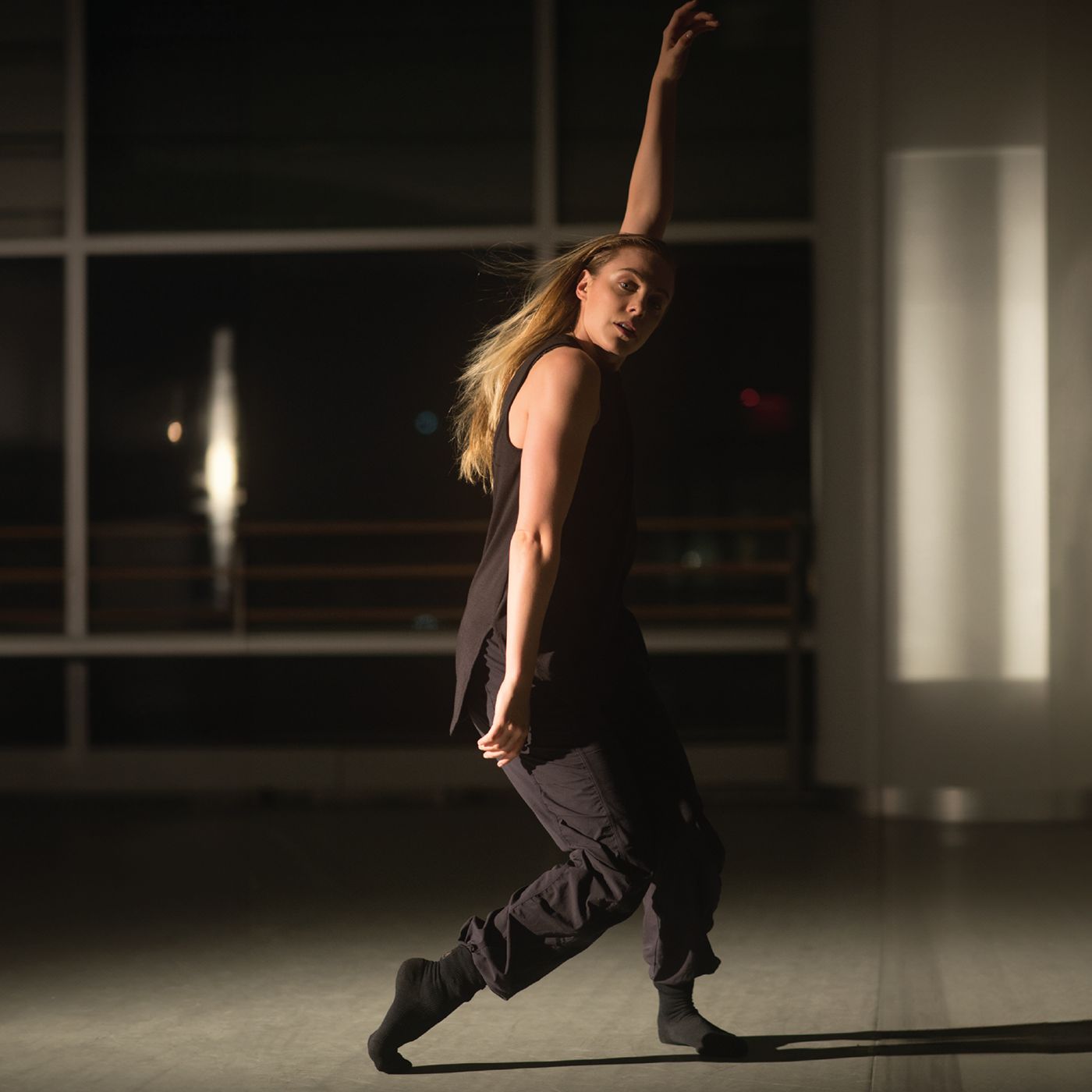 Woman dancing while wearing grip socks with ankle support